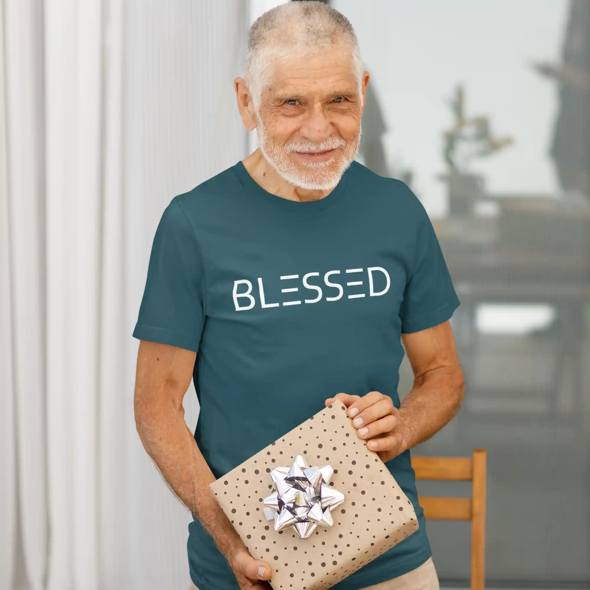 Elderly man wearing a deep teal Bella-Canvas t-shirt with white Blessed print