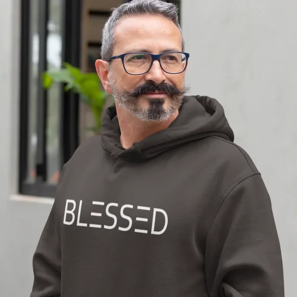 Man wearing hot chocolate Just Hoods hoodie with white Blessed print