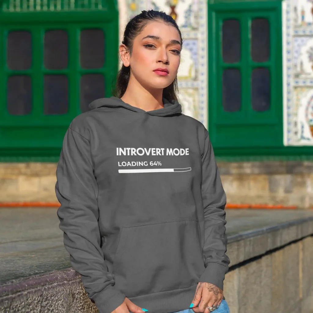 Woman wearing a steel grey Just Hoods hoodie with white Introvert Mode print