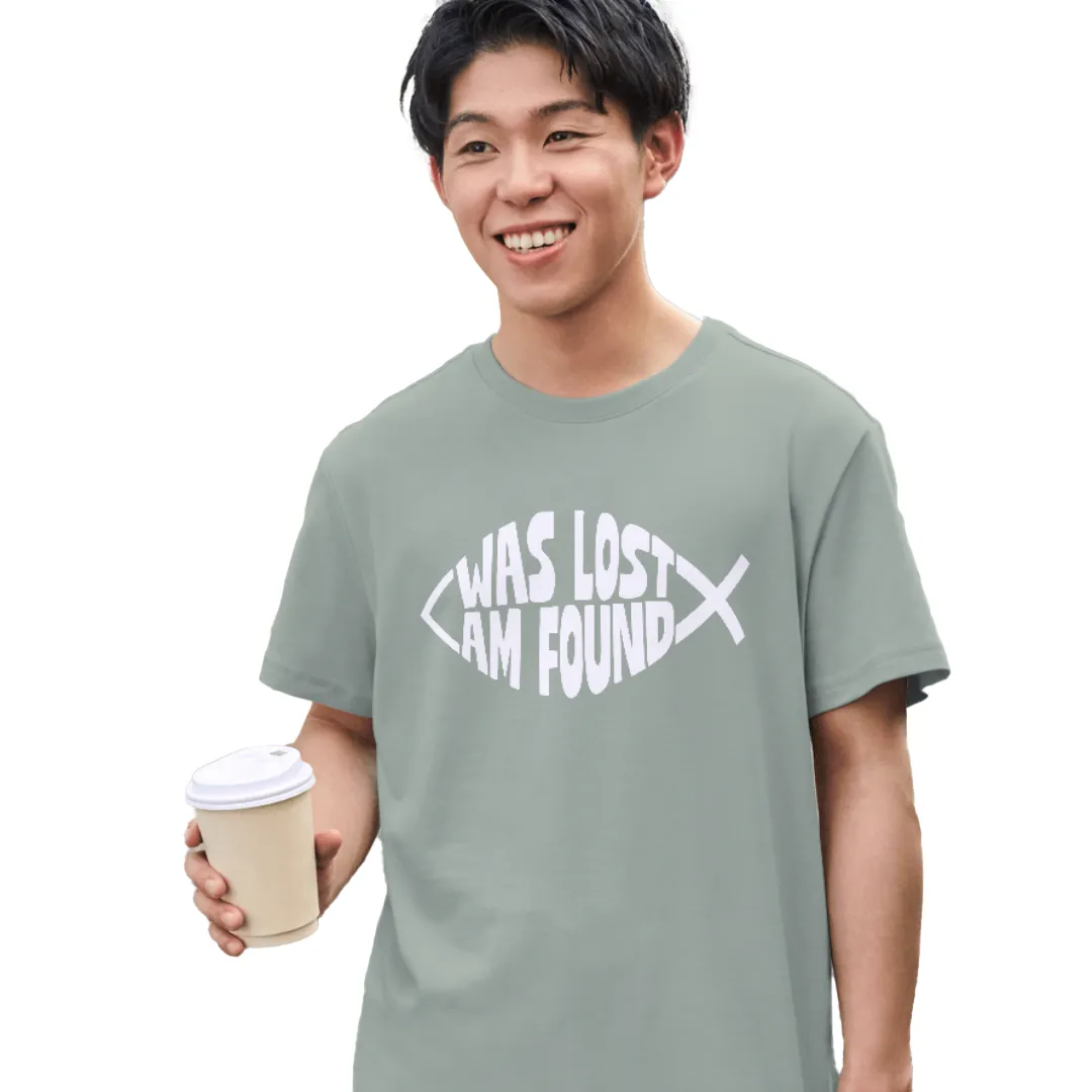 Man wearing a sage green Bella-Canvas t-shirt with white Found print