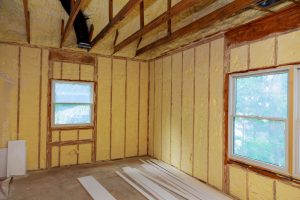 Foam plastic Insulation of a new home on a new roof Isolation in a new warming house