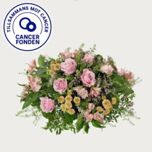 Rund begravningsdekoration med rosa blommor. 150 kr går till Cancerfonden. Skicka begravningsblommorna med ett bud via Interflora!