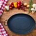 cast iron skillet on table with species