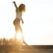 woman walking on fence