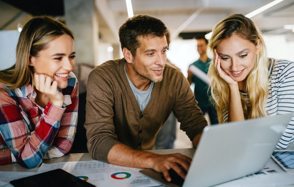 Group of business people and software developers working as a team in office