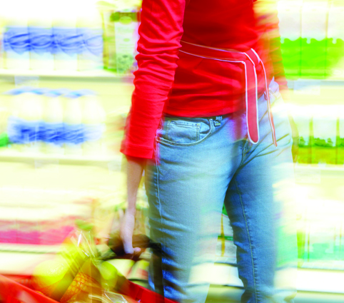Woman holding basket of shopping