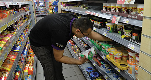 Shopworker stacking shelves