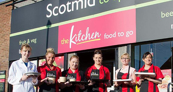 Staff outside Scotmid store