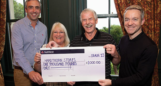 Maureen and Ewan Fraser receive cheque from Antony Begley