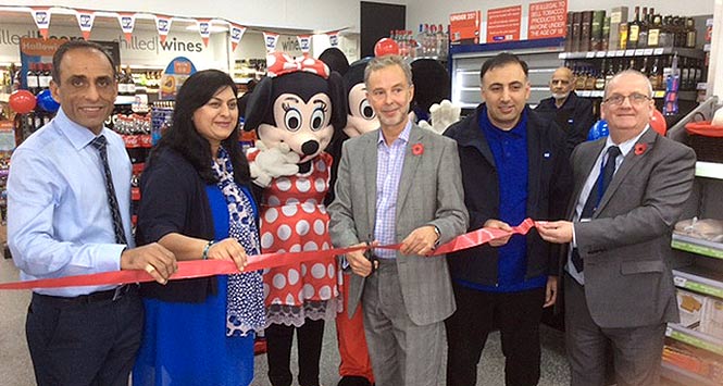 Cutting the ribbon at new store