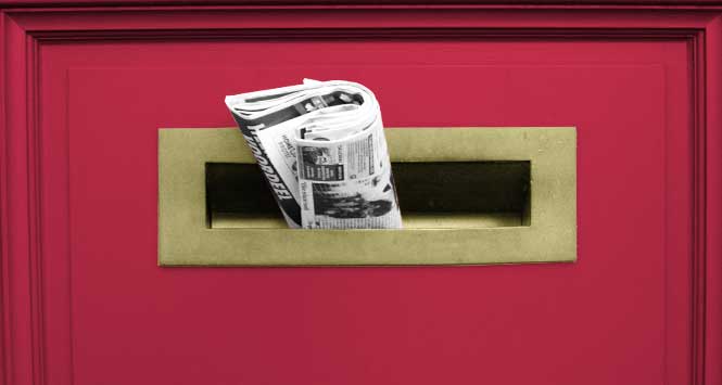 newspaper in letterbox