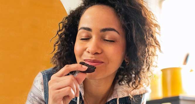 Woman eating Oreo