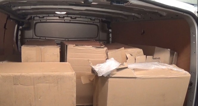 Boxes of illegal cigarettes in the back of a van