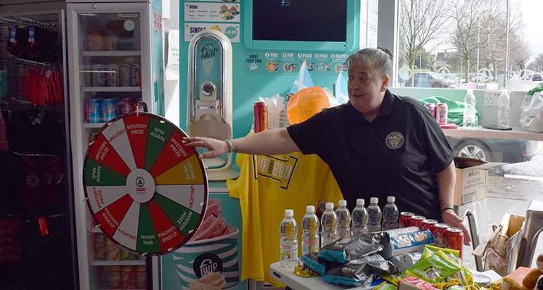 Woman spinning wheel of fortune