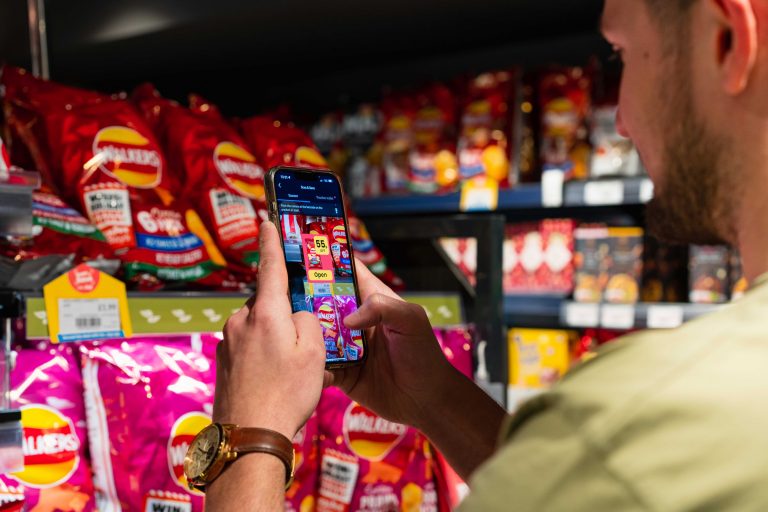 Mobile phone scans crisps in store to access promotion