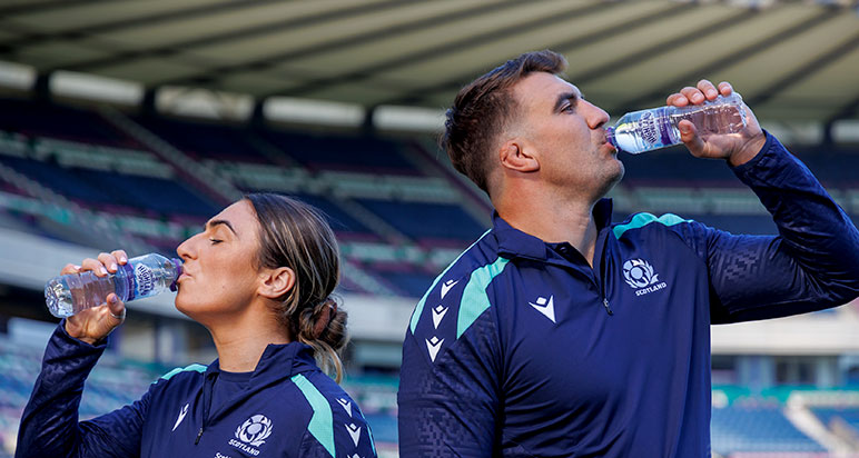 Rugby players drinking Highland Spring