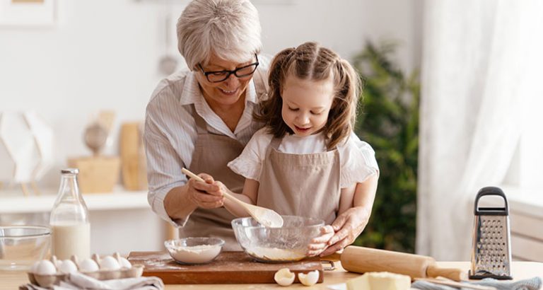 Gran and grandchild baking together