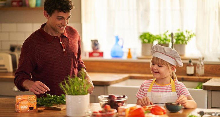 Small child cooking with Oxo