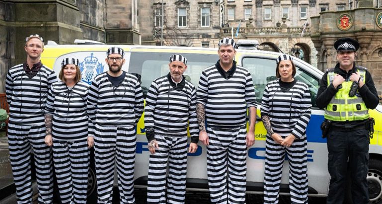 People in stripy prison uniforms