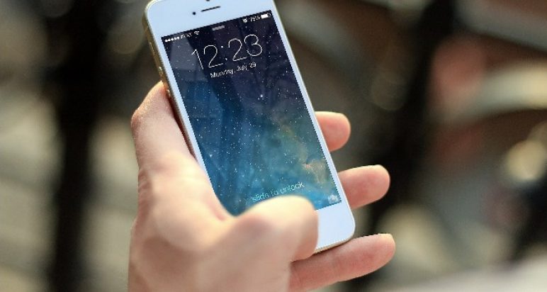 A person using their mobile phone