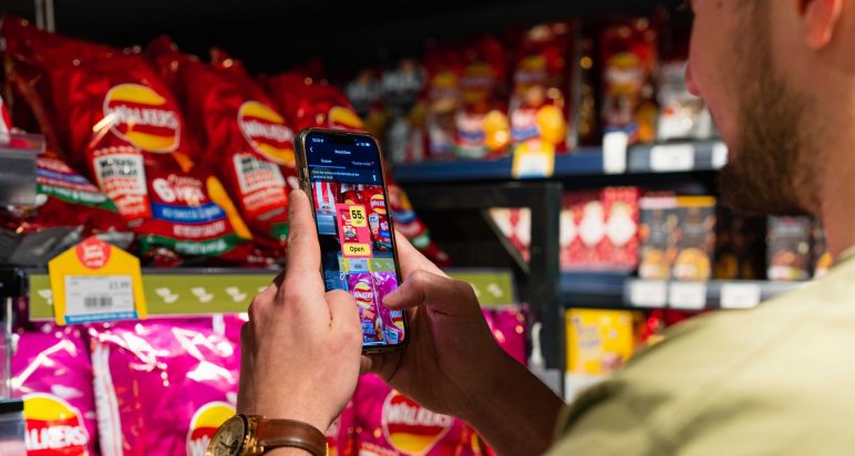 Mobile phone scans crisps in store to access promotion