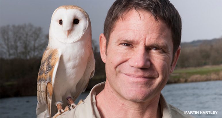 Steve Backshall with owl perched on his shoulder