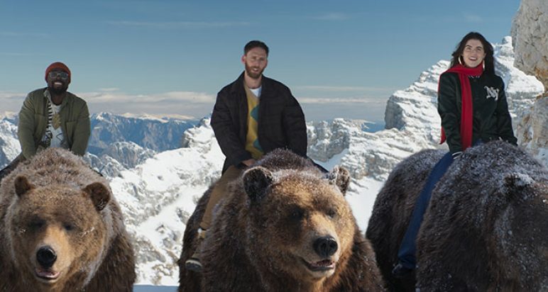 Three people riding bears