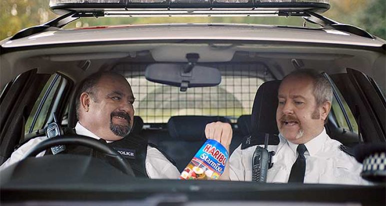 Policemen eating Haribo Starmix