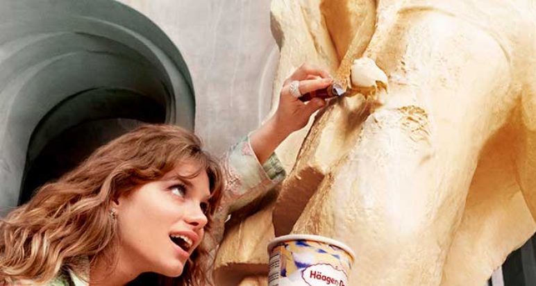 Woman eating ice cream sculpture