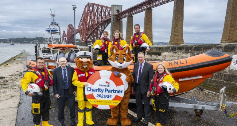 Image of Scotmid and RNLI people near the Forth Bridge
