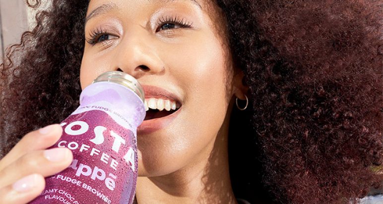 Girl drinking Costa Frappe