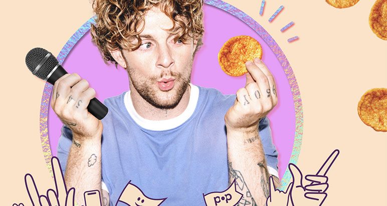 Tom Grennan holding a popchip