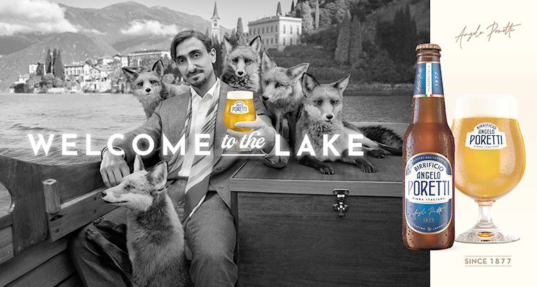 Foxes surround a man drinking Poretti