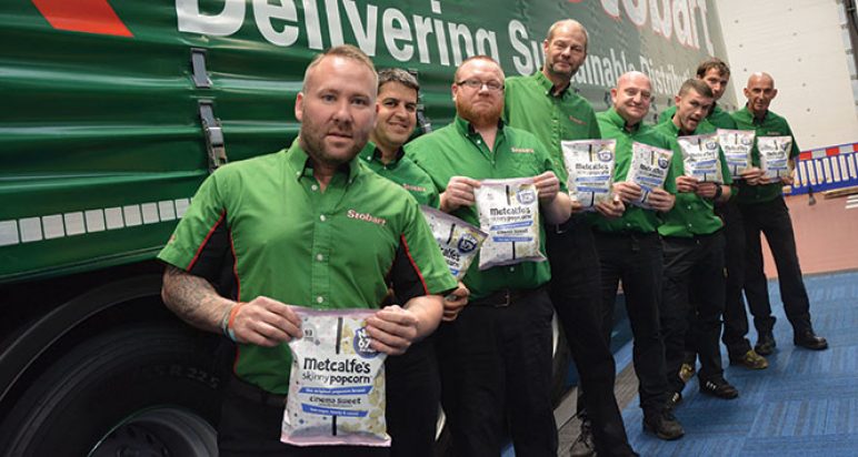 Eddie Stobart drivers holding Metcalfe's skinny popcorn