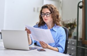 lady reading advanced transfer pricing agreement