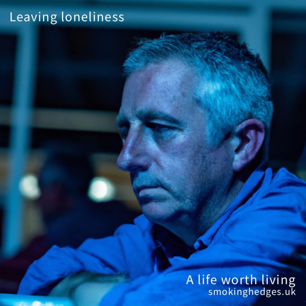 A sad looking man. Text saying Leaving loneliness.