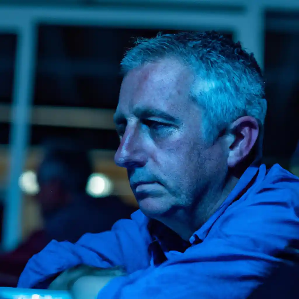 A 50 year old man sitting alone
