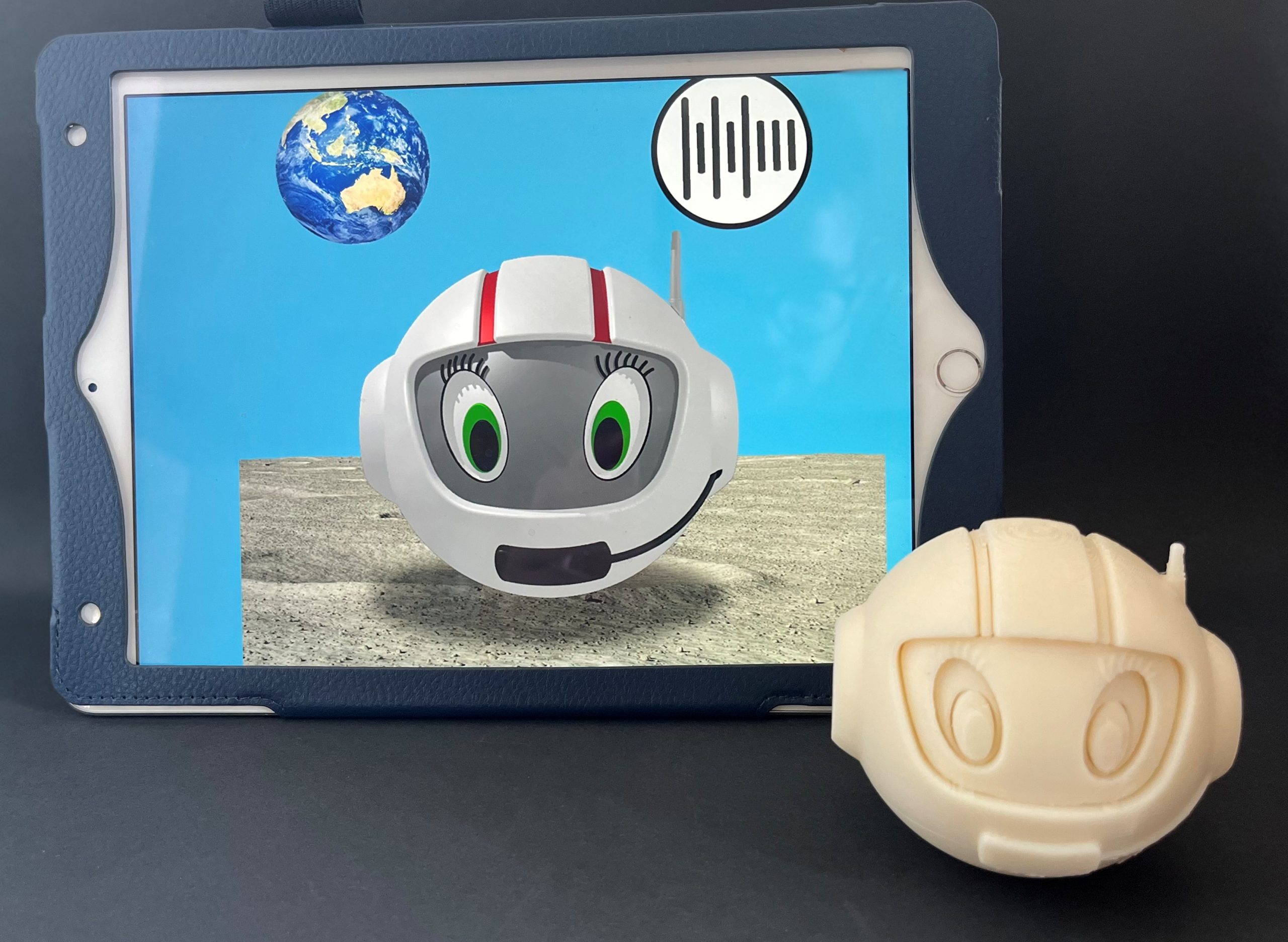 3D-printed CosmoBally next to iPad with digital app CosmoBally on Sonoplanet and