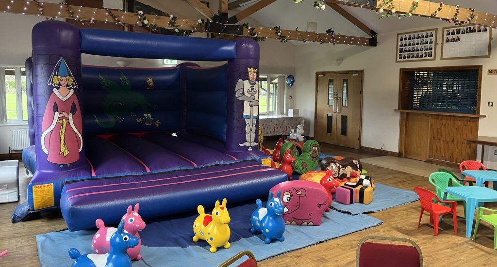 Bouncy castle with soft play and toddler tables and chairs - Fleming Park Bowls centre