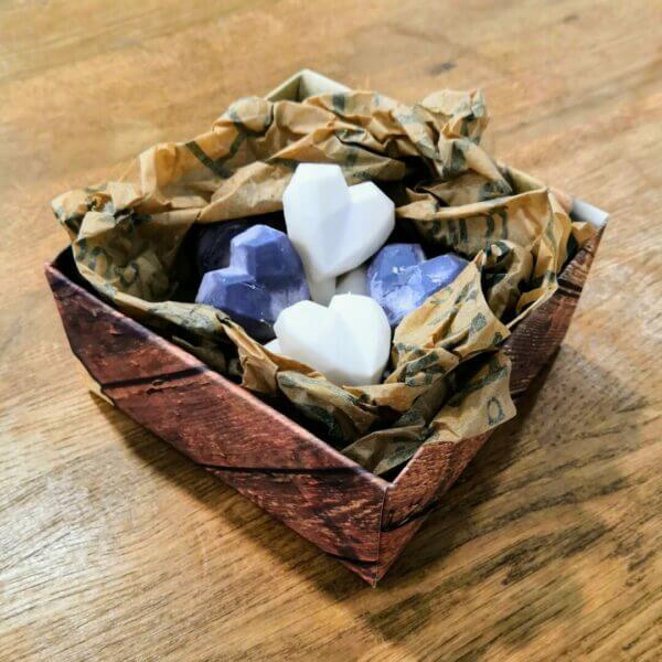 Box of black and white heart shaped soy wax melts in plastic free packaging