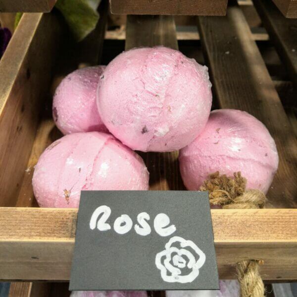 Rose coloured and scented bath bombs
