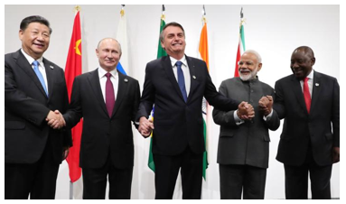 Chinese President Xi Jinping, Russian President Vladimir Putin, Brazilian President Jair Bolsonaro, India's Prime Minister Narendra Modi and South African President Cyril Ramaphosa pose during a BRICS meeting held during a G20 summit in Osaka in June 2019.