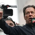 Pakistan’s former prime minister Imran Khan (R) addresses his supporters during an anti-government march towards capital Islamabad, demanding early elections, in Gujranwala on November 1, 2022.