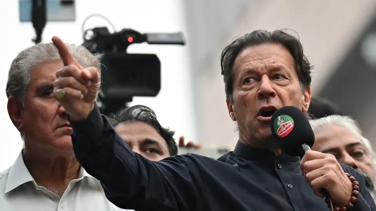 Pakistan’s former prime minister Imran Khan (R) addresses his supporters during an anti-government march towards capital Islamabad, demanding early elections, in Gujranwala on November 1, 2022.