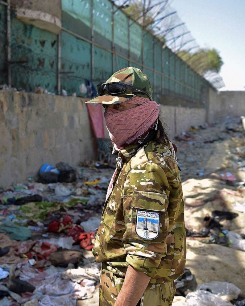 A member of the Taliban keeps watch at the location where twin suicide bombs struck on August 26, 2021, resulting in the deaths of numerous individuals, including 13 U.S. service members, at Kabul airport on August 27, 2021. Wakil Kohsar/AFP via Getty Images