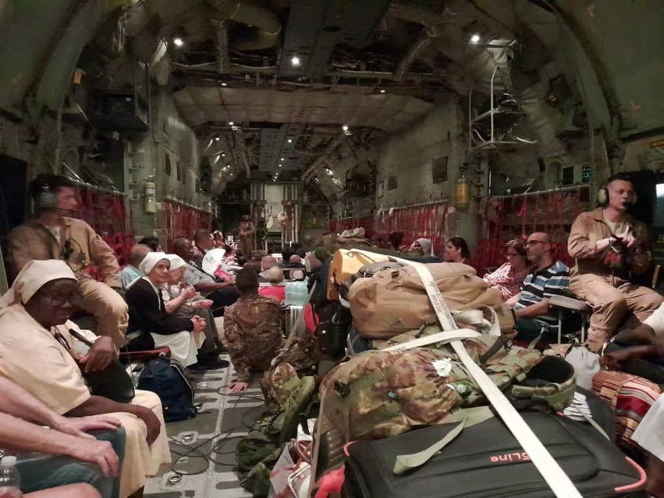 Italian citizens are seen being boarded onto an Italian Air Force C130 aircraft during their evacuation from Khartoum, Sudan on April 24, as depicted in this photo released by Ministero della Difesa/via REUTERS.