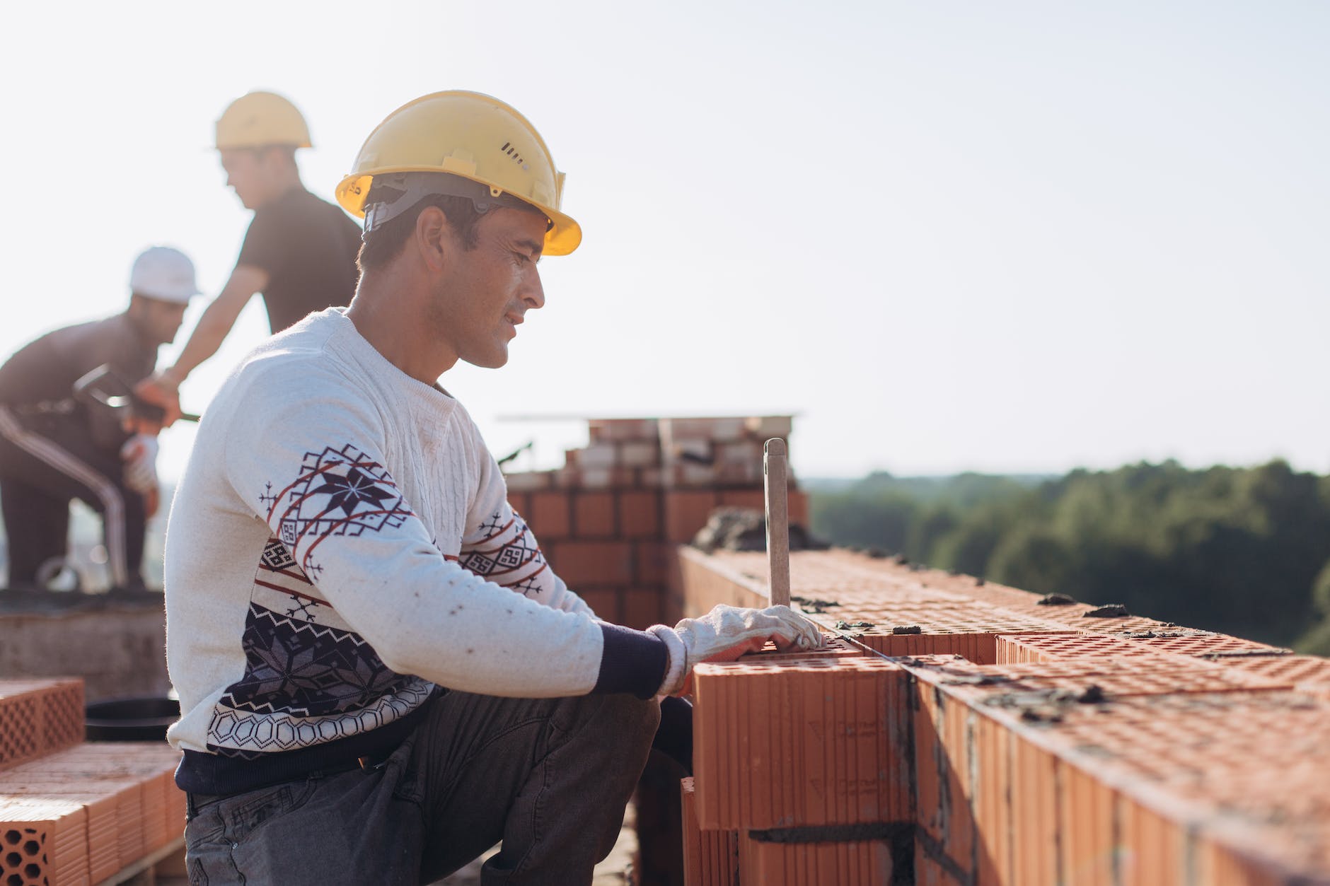 Celebrating International Workers' Day: Unleashing the Power of Workers' Rights  brick workers at construction site