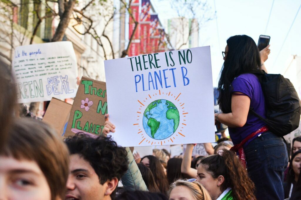 Climate change and what we can do?  person holding there is no planet b poster