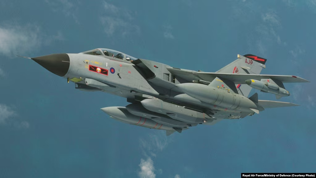 A photograph depicts a Tornado GR4 aircraft equipped with a Storm Shadow cruise missile that is mounted directly beneath the fuselage.