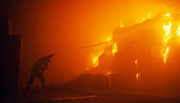 Rescuer Combats Blaze in Kyiv Building After Devastating Drone Attack on Ukrainian Capital.